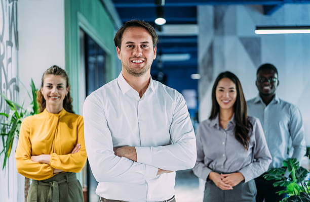 istock Confident businessman and his team. 2233762325