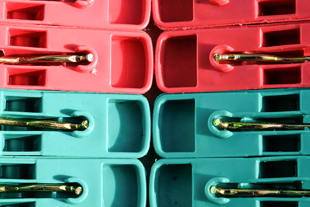 istock Close-up image of a stack of red and green plastic clothespins 2233765628