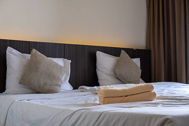istock Comfortable hotel mattress with crisp white bedding symbolizing cleanliness and relaxation 2233768629