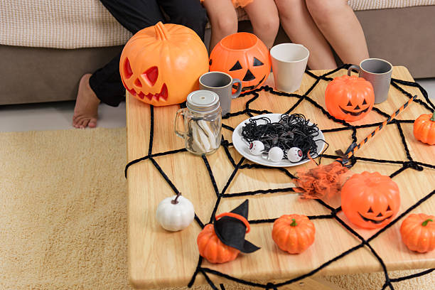 istock A table is decorated for a fun halloween day celebration, pumpkins and a spider web decorate the table for parties for children and adults at home 2233772729