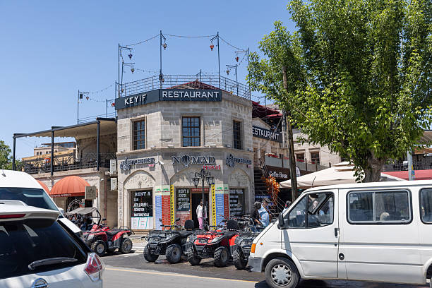 Kapadokya, Turkey - July 11, 2023: Shops at the main street in Uchisar Castle,Cappadocia, Turkey