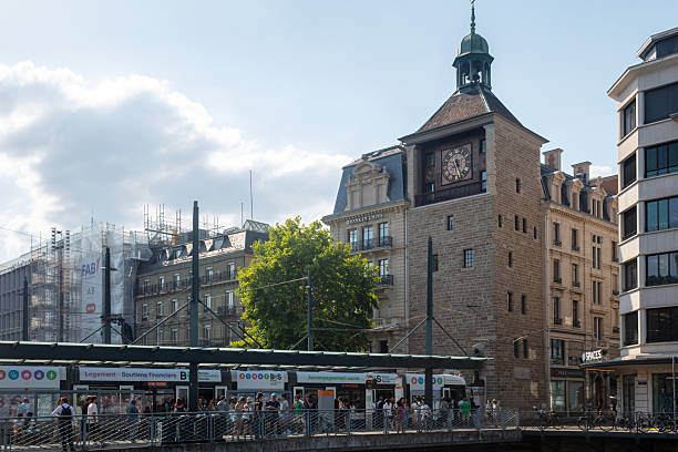 A blurred wide shot of a train passing on a railway track in Zurich, Switzerland on a sunny Summer day.