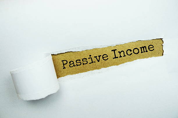 istock Passive Income message written on craft paper with torn paper background 2233777784
