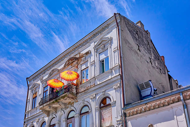 Window facade with different design and architectural features with colorful patio on building exterior in the city of Bucharest, Romania Europe