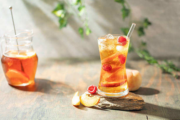 istock Peach Raspberry iced Tea in galss. Summer refreshing drink 2233781193