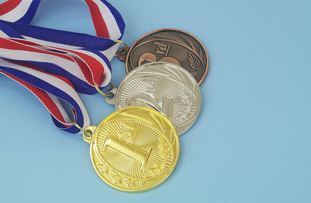 istock Gold, silver and bronze medal on blue background 2233781543