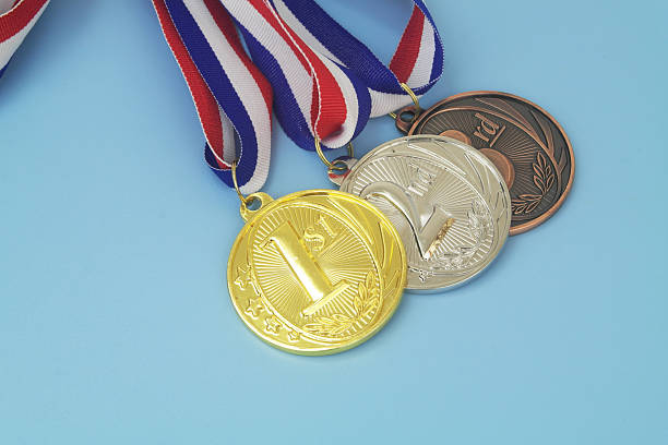istock Gold, silver and bronze medal on blue background 2233781651