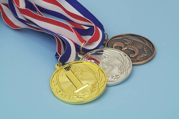 istock Gold, silver and bronze medal on blue background 2233781697