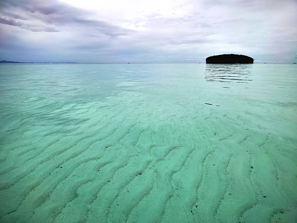 View at Pasir Timbul (emerging sand), an idyllic sandbank located near Kri island, known for their stunningly clear waters in Raja Ampat, West Papua, Indonesia.