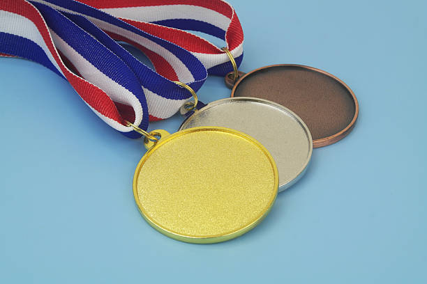 istock Gold, silver and bronze medal on blue background 2233781823