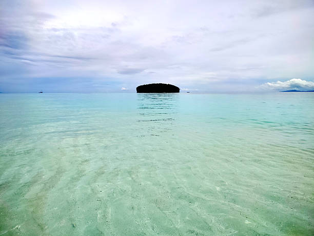 View at Pasir Timbul (emerging sand), an idyllic sandbank located near Kri island, known for their stunningly clear waters in Raja Ampat, West Papua, Indonesia.