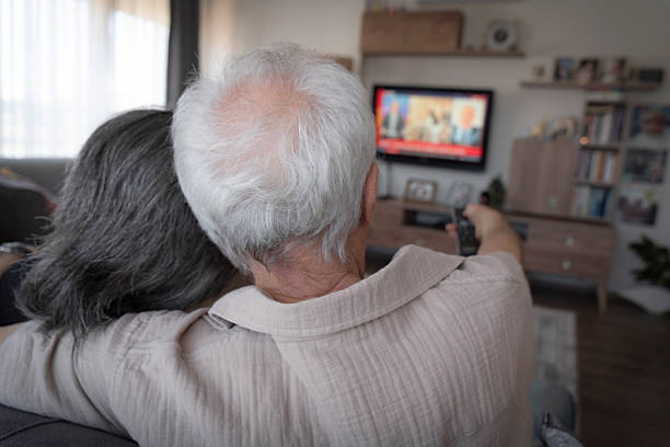 istock Senior couple watching TV 2233782319