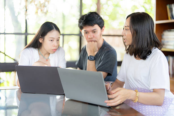 istock In preparation for tomorrow, 3 Asian students work on a project with a laptop, balancing education goals and industry knowledge to strengthen their readiness for the future. 2233783300