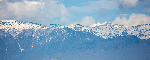 istock The mountains are covered in snow and the sky is blue 2233786062