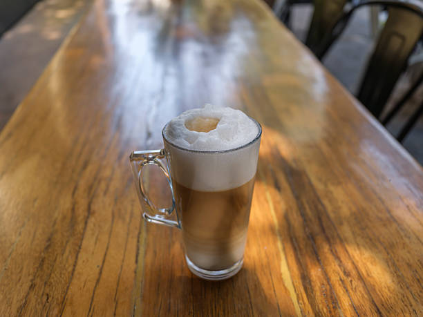 istock delicious frothy cappuccino in glass cup 2233786368