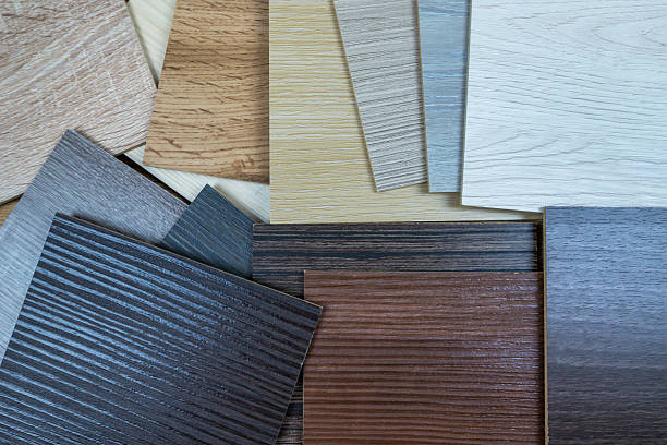 istock wooden premium sampler for design of modern apartments.Laminate background. Samples of laminate or parquet with a pattern and wood texture for flooring and interior design. Production of wooden floors 2233786548