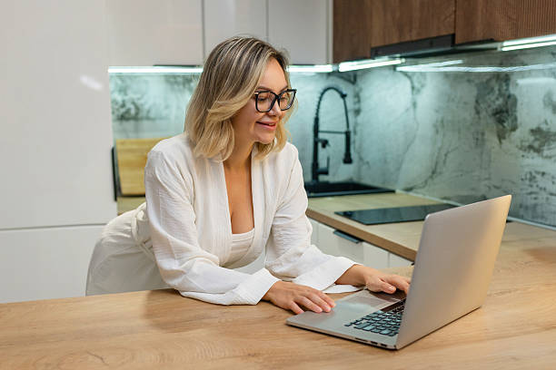 istock Freelance woman working on laptop in modern 2233788497