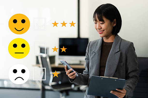 istock User give rating to service experience on online application smartphone. 2233794641