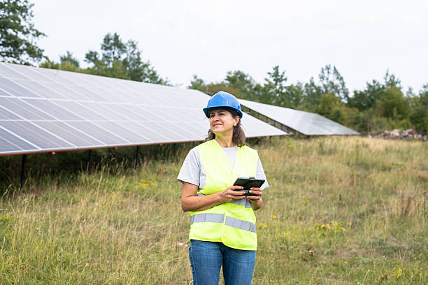 istock A female worker uses a drone to maintain a solar cell 2233794707
