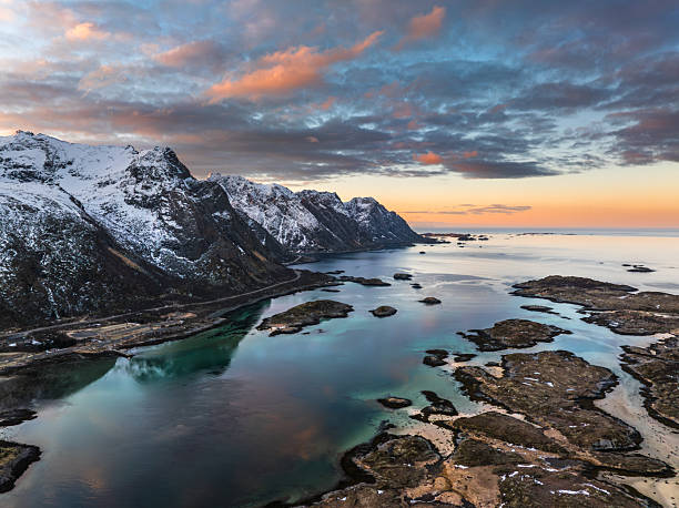istock Snow-Capped Mountains and Ocean at Sunset 2233795930