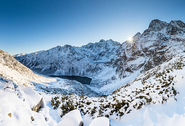 istock Snowy Mountain Landscape with Sunburst 2233796031