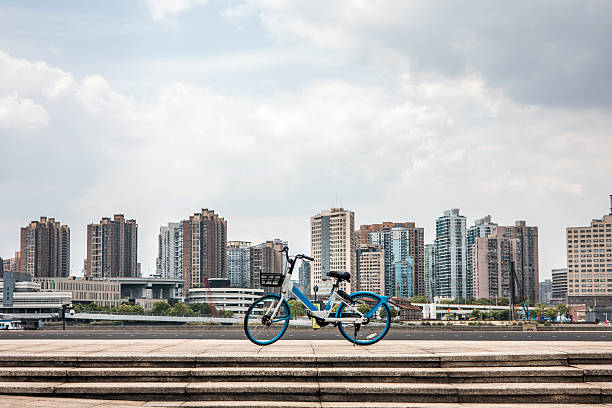 Bicycle with a city skyline in the distance