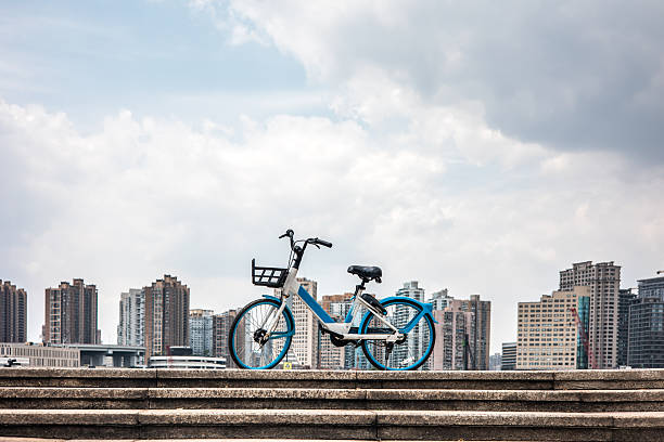 istock Bicycle with a city skyline in the distance 2233802971