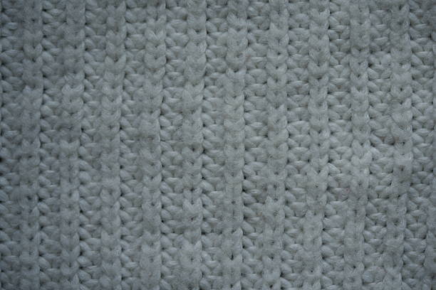 Here is a detailed view showcasing a natural, textured beige fabric that features a beautiful woven pattern