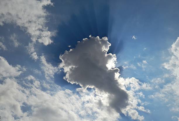 Lights of Hope Leaking Behind Cumulus Clouds\