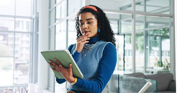 istock Decision, design and tablet with business woman in office for ideas, problem solving or thinking. App, planning and research with designer in creative workplace for brainstorming or online solution 2233807662