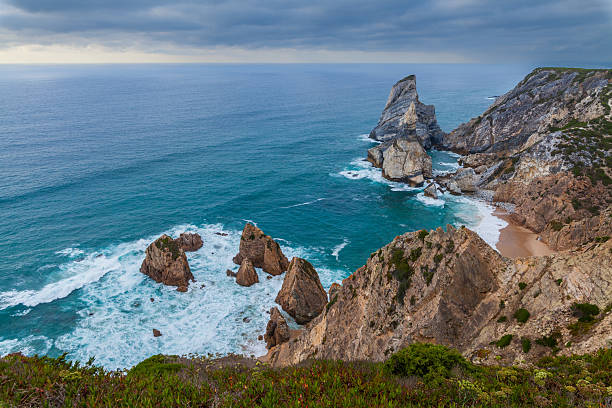 istock A dramatic coastal landscape featuring rugged cliffs, turquoise waters, and crashing waves 2233809781