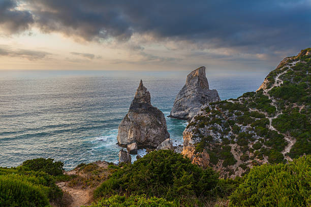 istock A dramatic coastal landscape featuring rugged cliffs, turquoise waters, and crashing waves 2233809929