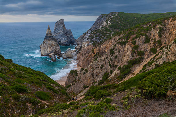 istock A dramatic coastal landscape featuring rugged cliffs, turquoise waters, and crashing waves 2233809952