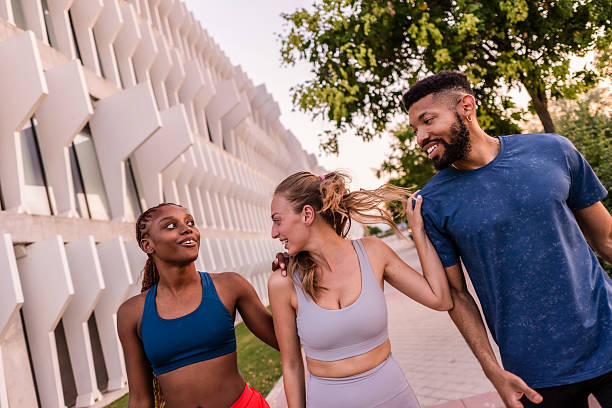 istock Happy athletes walking and talking after workout session 2233810010