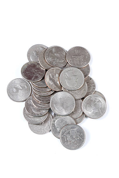 istock US currency in quarters on white background 2233810605