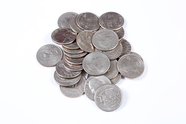istock US currency in quarters on white background 2233810606
