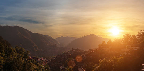 istock Village in the valley with sunset sky background. 2233810700