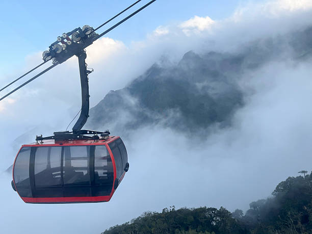 istock Cable car above mountains with mist covered 2233810818