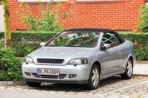 Berlin, Germany - September 12, 2013: Convertible car Opel Astra G Bertone Cabriolet in the city street.