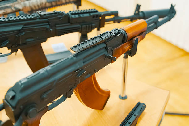 istock Kalashnikov assault rifle on display stand at an exhibition. 2233811845