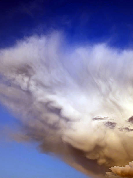 istock Thick stormy thunderstorm clouds in a blue sky 2233814338