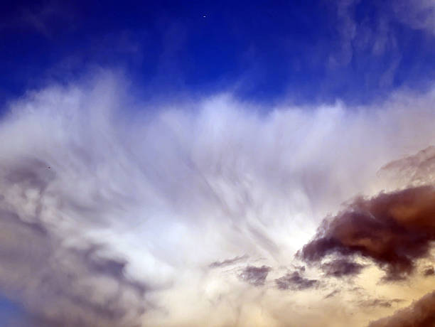 istock Thick stormy thunderstorm clouds in a blue sky 2233814437