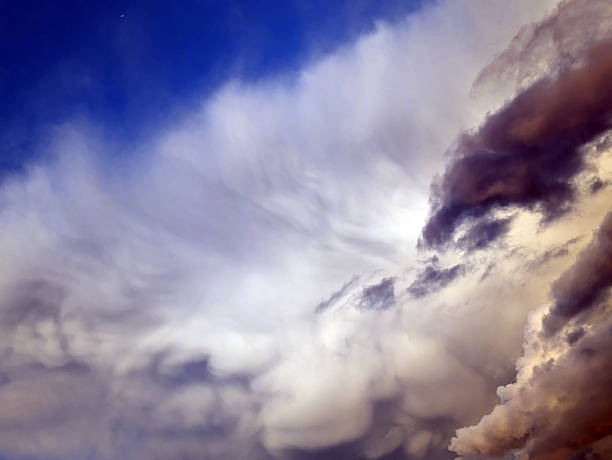 Thick stormy thunderstorm clouds in a blue sky