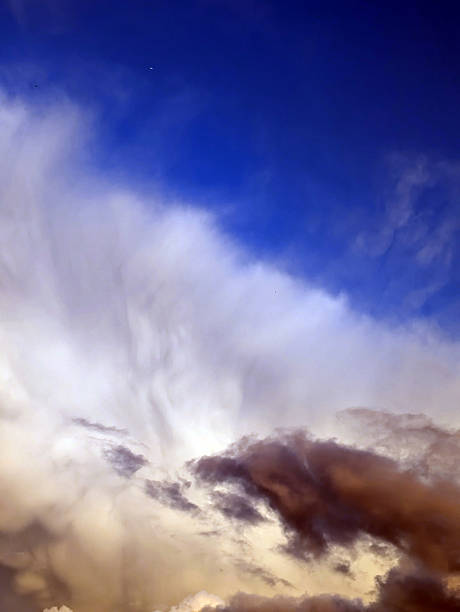 istock Thick stormy thunderstorm clouds in a blue sky 2233814444