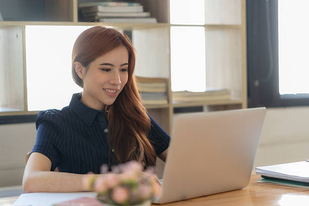 istock Confident businesswoman sitting at her workspace. 2233814881