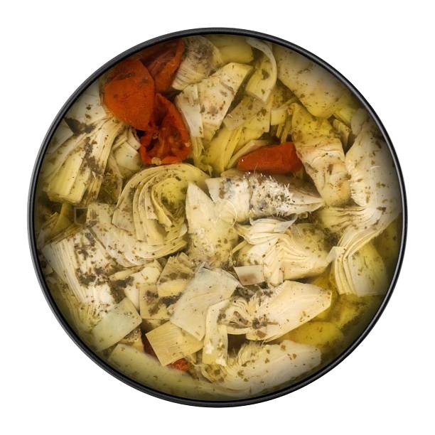 Marinated artichoke hearts with sun-dried tomatoes and oregano in olive oil.