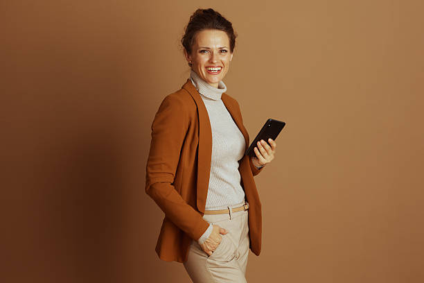 istock Confident Businesswoman with Device and Friendly Smile 2233816606