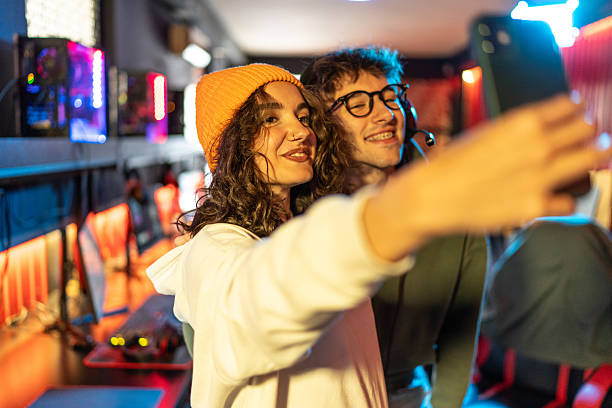 istock Gamers taking a selfie after winning a tournament 2233818484