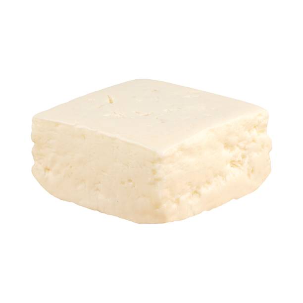 istock Block of fresh white cheese isolated on white. 2233818926