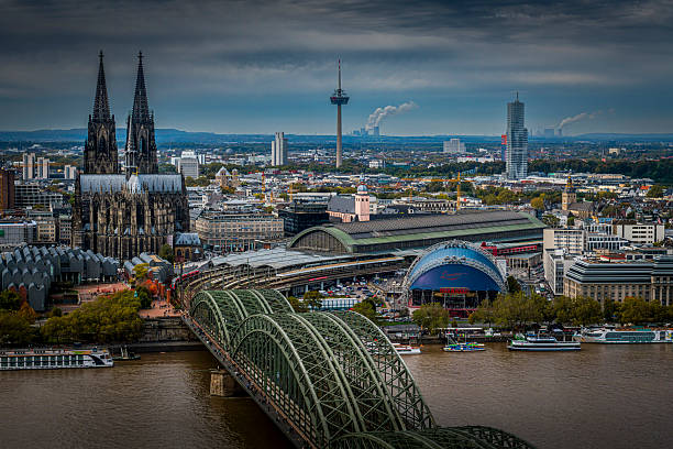 Cologne, Germany - October 12, 2024: aerial view of Cologne in Germany with Hohenzoller Bridge and Cologne Cathedral and Rhine River
